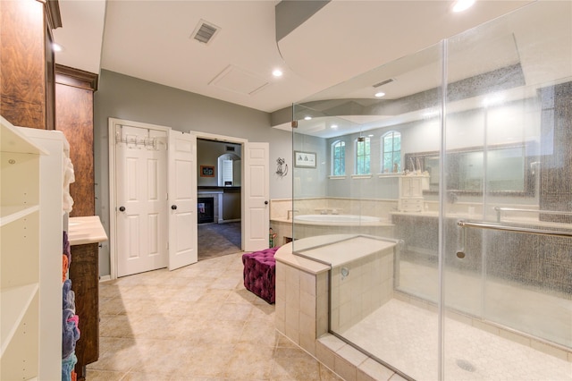 62 W Mirror Ridge Cir, The Woodlands, TX 77382 - bathroom with a bath, tile patterned floors, a shower stall, vanity, and recessed lighting