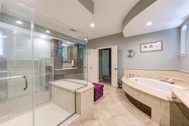 62 W Mirror Ridge Cir, The Woodlands, TX 77382 - full bathroom featuring a bath, a shower stall, recessed lighting, and tile patterned flooring