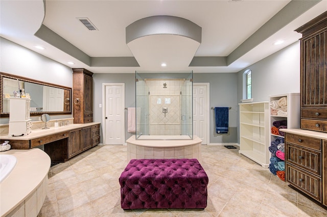 62 W Mirror Ridge Cir, The Woodlands, TX 77382 - bathroom with a shower stall, recessed lighting, a tray ceiling, vanity, and baseboards