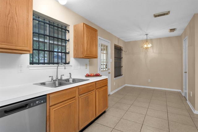 11539 Byronstone Dr, Houston, TX 77066 - kitchen featuring stainless steel dishwasher, a sink, light countertops, and plenty of natural light