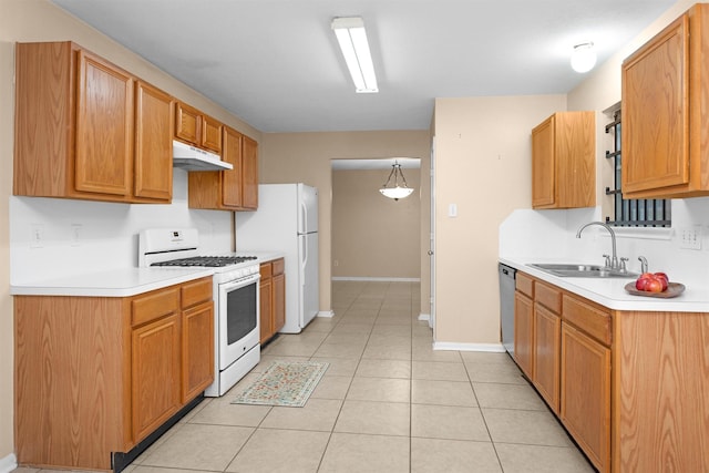 11539 Byronstone Dr, Houston, TX 77066 - kitchen featuring white appliances, under cabinet range hood, a sink, and light countertops