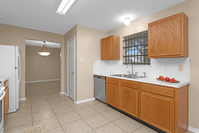 11539 Byronstone Dr, Houston, TX 77066 - kitchen with dishwasher, a sink, freestanding refrigerator, light countertops, and baseboards
