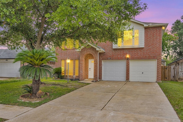 11539 Byronstone Dr, Houston, TX 77066 - view of front of house featuring an attached garage, brick siding, and driveway