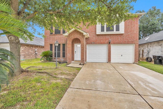 11539 Byronstone Dr, Houston, TX 77066 - view of front of home with a garage, driveway, brick siding, and a front lawn