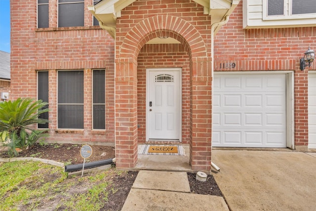 11539 Byronstone Dr, Houston, TX 77066 - entrance to property featuring brick siding, driveway, and an attached garage