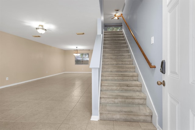 11539 Byronstone Dr, Houston, TX 77066 - staircase with tile patterned flooring and baseboards