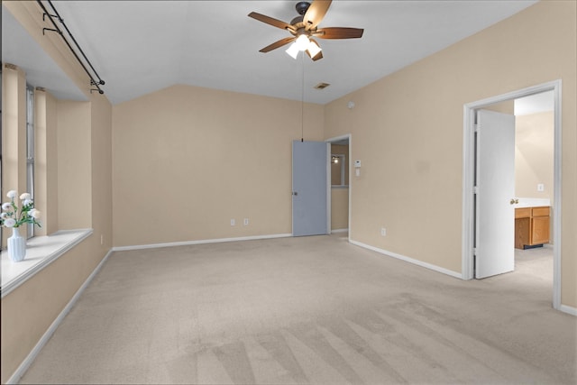 11539 Byronstone Dr, Houston, TX 77066 - unfurnished bedroom with vaulted ceiling, carpet floors, baseboards, a ceiling fan, and ensuite bathroom