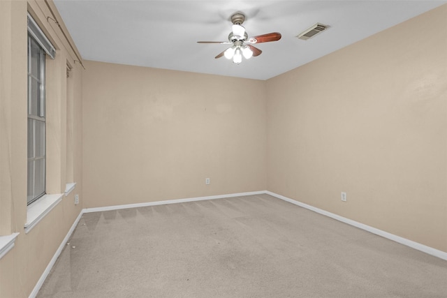 11539 Byronstone Dr, Houston, TX 77066 - spare room featuring carpet flooring, a ceiling fan, and baseboards