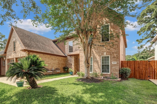 10010 Silverwood Way, Houston, TX 77070 - view of front of property featuring brick siding, roof with shingles, and a garage