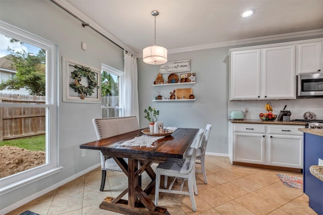 10010 Silverwood Way, Houston, TX 77070 - dining space featuring light tile patterned flooring, baseboards, ornamental molding, and recessed lighting