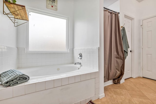 10010 Silverwood Way, Houston, TX 77070 - bathroom featuring a garden tub and tile patterned flooring