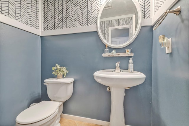 10010 Silverwood Way, Houston, TX 77070 - half bathroom featuring toilet, tile patterned flooring, and baseboards