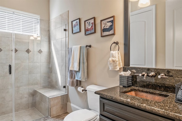 27309 S Lazy Meadow Way, Spring, TX 77386 - bathroom featuring vanity, a shower stall, toilet, and tasteful backsplash