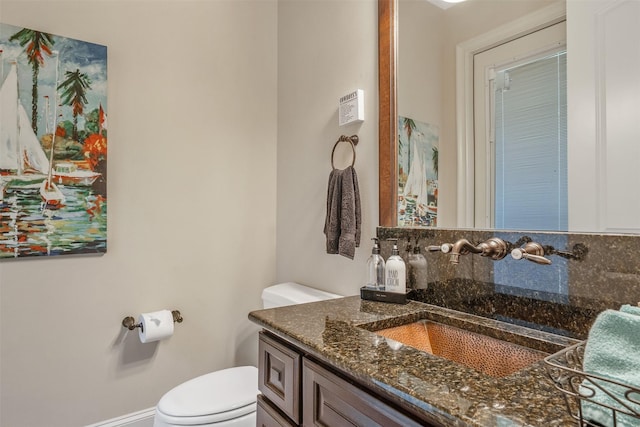27309 S Lazy Meadow Way, Spring, TX 77386 - half bathroom with toilet, vanity, and backsplash