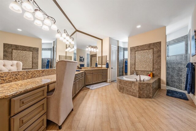 27309 S Lazy Meadow Way, Spring, TX 77386 - full bathroom with a bath, wood finished floors, and vanity