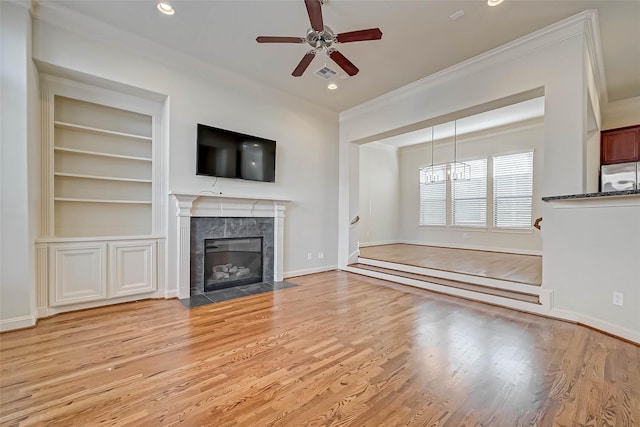 5617 Kiam St Unit A, Houston, TX 77007 - unfurnished living room with ornamental molding, light wood finished floors, a premium fireplace, ceiling fan, and recessed lighting