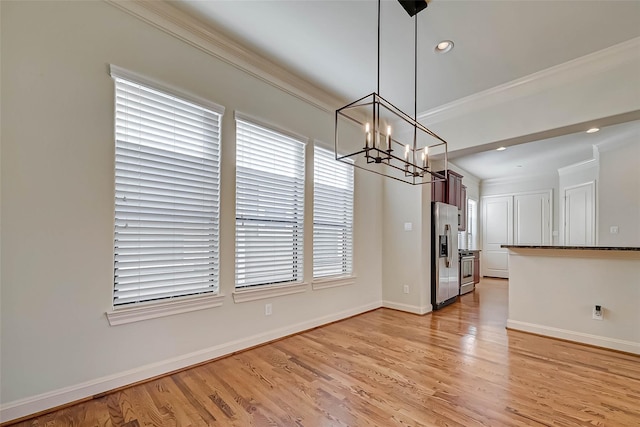 5617 Kiam St Unit A, Houston, TX 77007 - unfurnished dining area with a chandelier, light wood-style floors, baseboards, ornamental molding, and recessed lighting