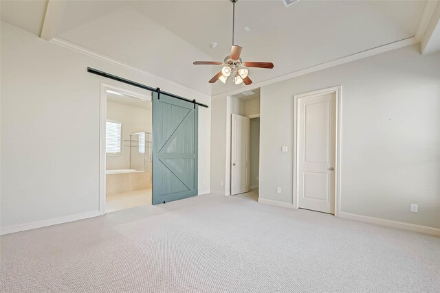 5617 Kiam St Unit A, Houston, TX 77007 - unfurnished bedroom featuring carpet flooring, baseboards, a barn door, connected bathroom, and ceiling fan