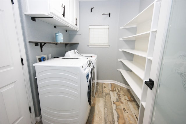 8611 Riverbend Canyon Ln, Houston, TX 77089 - laundry area featuring cabinet space, washing machine and clothes dryer, and baseboards