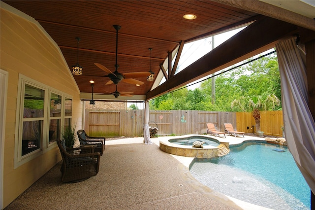 8611 Riverbend Canyon Ln, Houston, TX 77089 - view of swimming pool featuring a pool with connected hot tub, a ceiling fan, a fenced backyard, and a patio area