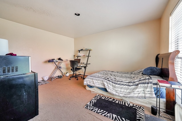 9090 S Braeswood Blvd Unit 107, Houston, TX 77074 - carpeted bedroom featuring refrigerator