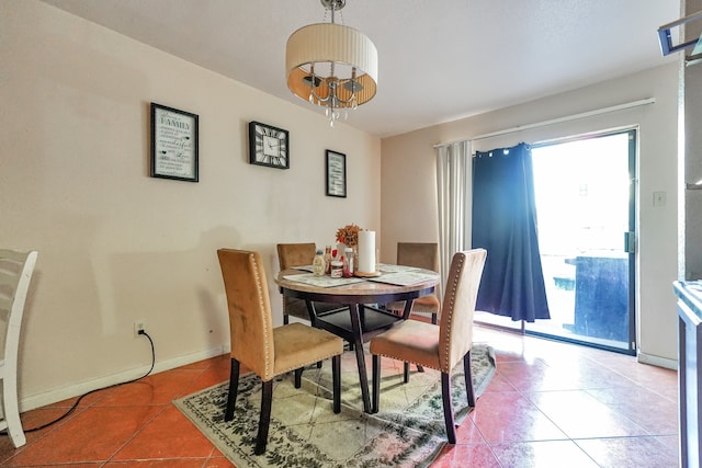 9090 S Braeswood Blvd Unit 107, Houston, TX 77074 - dining area featuring plenty of natural light, tile patterned flooring, and baseboards