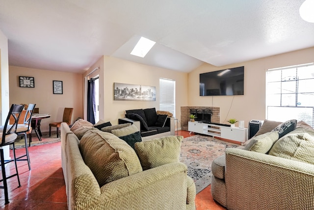 9090 S Braeswood Blvd Unit 107, Houston, TX 77074 - living area featuring a skylight and a fireplace