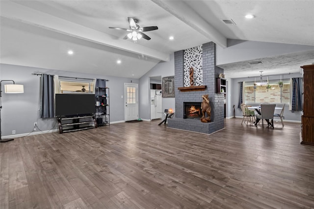 20074 Crazy Horse Circle Dr, Katy, TX 77449 - living room featuring baseboards, ceiling fan, a fireplace, and wood finished floors