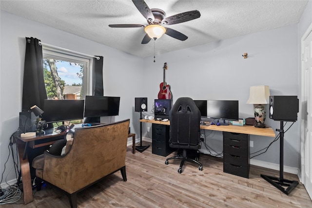 20074 Crazy Horse Circle Dr, Katy, TX 77449 - office area featuring ceiling fan, wood finished floors, a textured ceiling, and baseboards