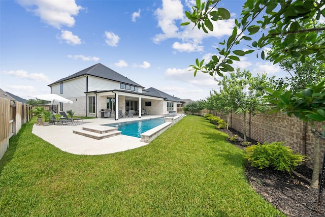 20511 Grazing Foal Ln, Tomball, TX 77377 - back of house featuring a patio area and brick siding