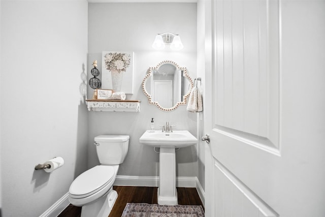 20511 Grazing Foal Ln, Tomball, TX 77377 - half bathroom featuring wood finished floors, toilet, and baseboards