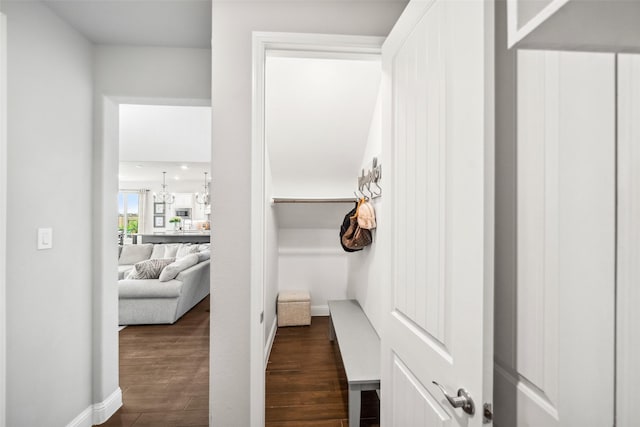 20511 Grazing Foal Ln, Tomball, TX 77377 - corridor with dark wood-type flooring, a chandelier, and baseboards