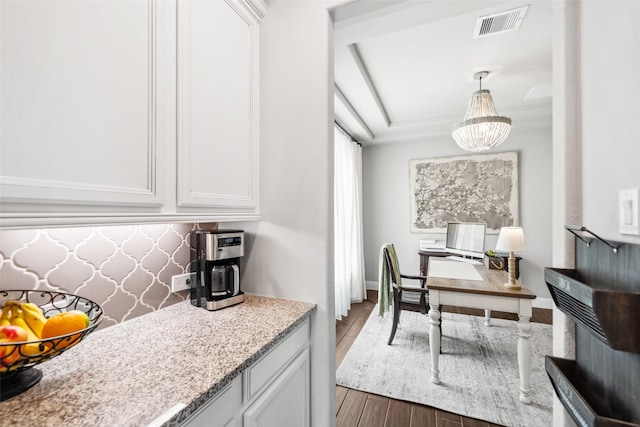 20511 Grazing Foal Ln, Tomball, TX 77377 - kitchen featuring wood finished floors, a chandelier, white cabinets, and decorative light fixtures