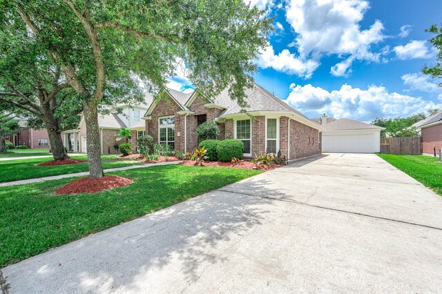 2604 Sunday House Ct, Pearland, TX 77584 - traditional-style house with brick siding, driveway, an attached garage, and a shingled roof