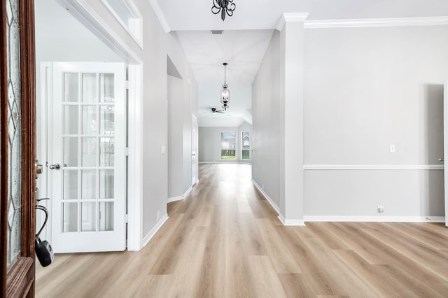 2604 Sunday House Ct, Pearland, TX 77584 - foyer with light wood finished floors, baseboards, lofted ceiling, and crown molding