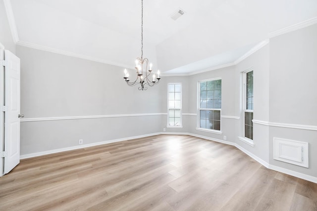 2604 Sunday House Ct, Pearland, TX 77584 - unfurnished room featuring a chandelier, light wood finished floors, ornamental molding, vaulted ceiling, and baseboards
