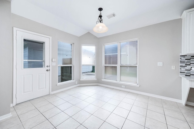 2604 Sunday House Ct, Pearland, TX 77584 - unfurnished dining area with baseboards, vaulted ceiling, and light tile patterned flooring
