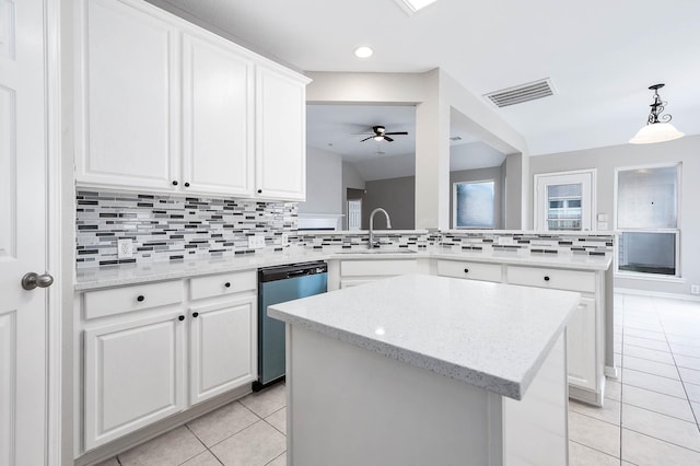 2604 Sunday House Ct, Pearland, TX 77584 - kitchen featuring dishwashing machine, a sink, light tile patterned floors, a kitchen island, and decorative backsplash