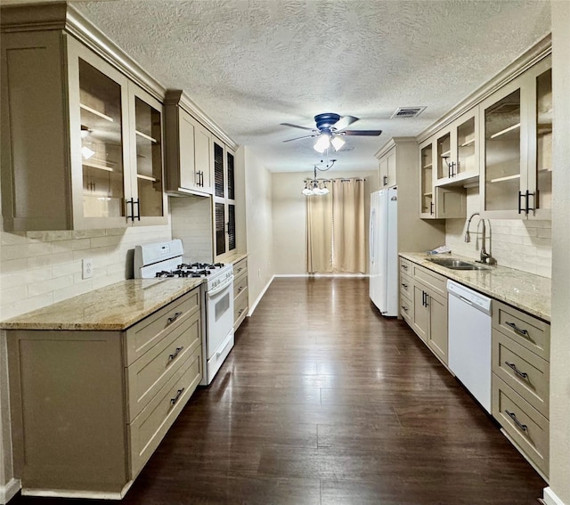 3611 Acorn Way Ln, Spring, TX 77389 - kitchen with white appliances, a sink, ceiling fan, tasteful backsplash, and dark wood-style flooring