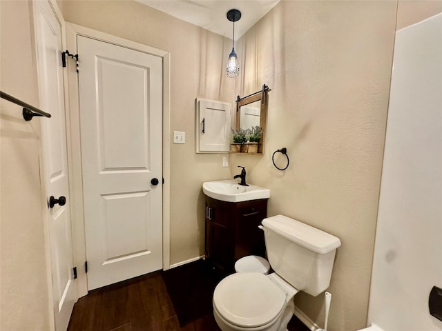 3611 Acorn Way Ln, Spring, TX 77389 - bathroom featuring vanity, toilet, and wood finished floors