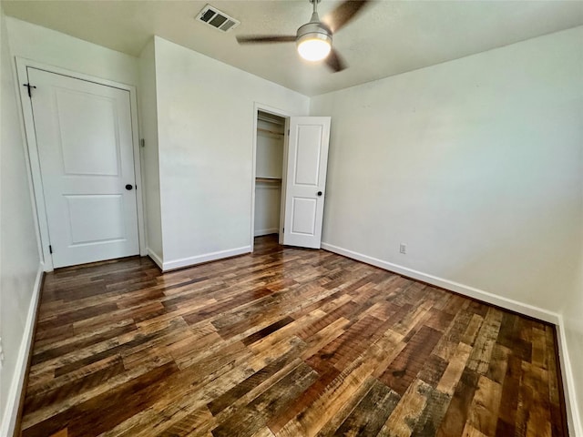 3611 Acorn Way Ln, Spring, TX 77389 - unfurnished bedroom featuring dark wood-type flooring, a closet, baseboards, and a ceiling fan