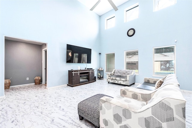 18110 Tenasserim Pine Trce, Richmond, TX 77407 - living room with a towering ceiling, baseboards, and marble finish floors
