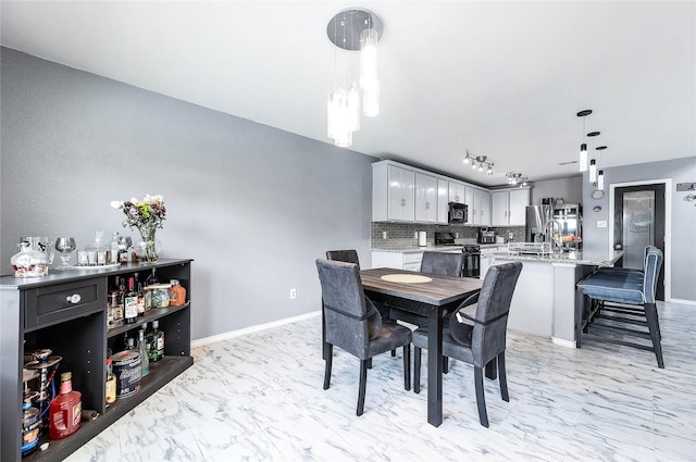 18110 Tenasserim Pine Trce, Richmond, TX 77407 - dining area with light marble finish floors and baseboards