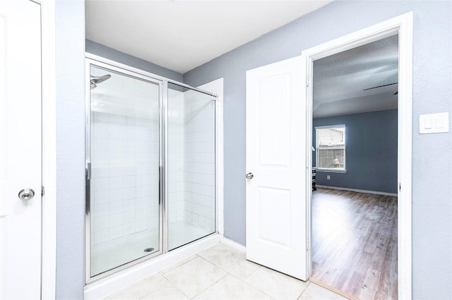 18110 Tenasserim Pine Trce, Richmond, TX 77407 - full bath featuring a shower stall, tile patterned flooring, and baseboards
