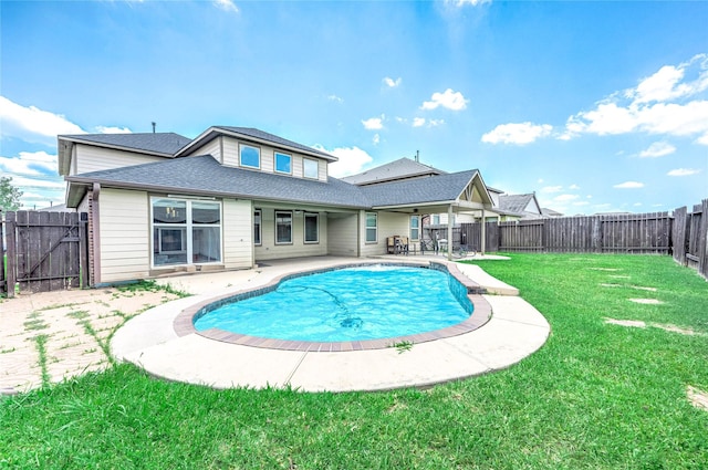 18110 Tenasserim Pine Trce, Richmond, TX 77407 - rear view of house with a patio area and a shingled roof