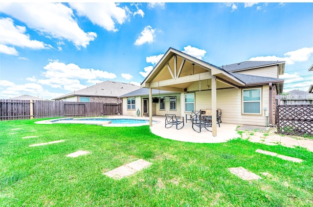 18110 Tenasserim Pine Trce, Richmond, TX 77407 - rear view of property with a patio area and a shingled roof