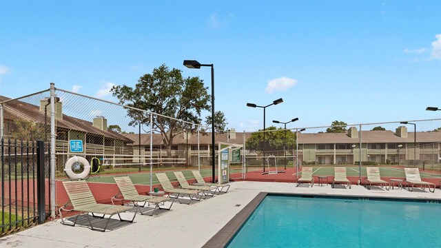 14777 Wunderlich Dr Unit 2013, Houston, TX 77069 - community pool with a tennis court