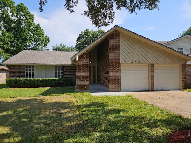 21631 Park Villa Dr, Katy, TX 77450 - view of front facade with brick siding, concrete driveway, an attached garage, and a front yard