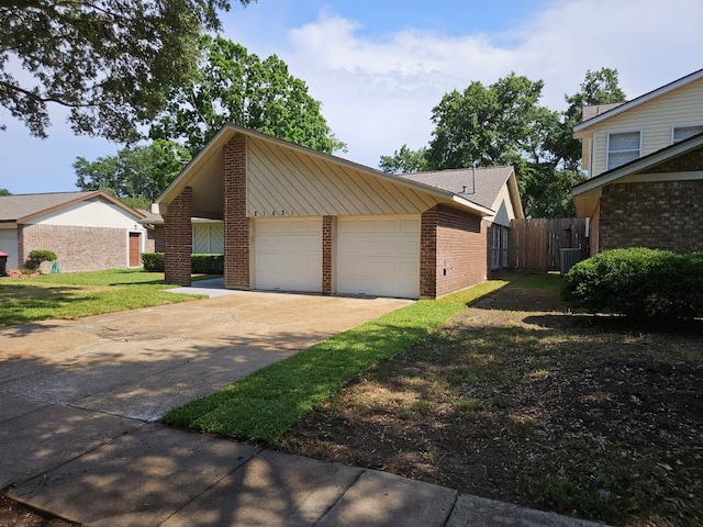 21631 Park Villa Dr, Katy, TX 77450 - view of property exterior with brick siding, a garage, and central air condition unit