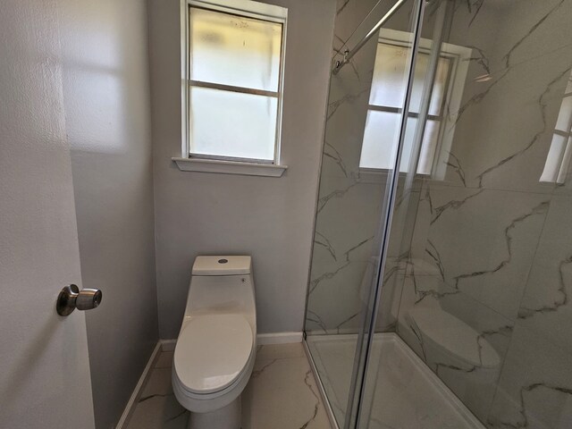 21631 Park Villa Dr, Katy, TX 77450 - bathroom with a marble finish shower, toilet, and baseboards